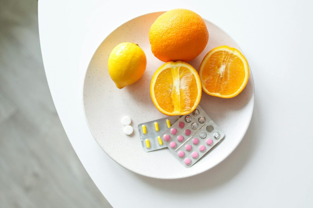 Benefits of jump rope A plate of fresh citrus fruits and blister packs of pills, highlighting nutrition and healthcare.